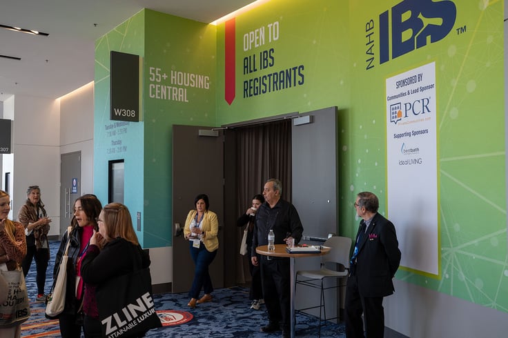 People standing in hallway, exiting conference room