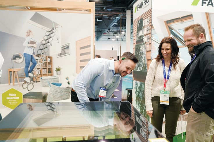 Building professionals discuss products on the IBS exhibit floor