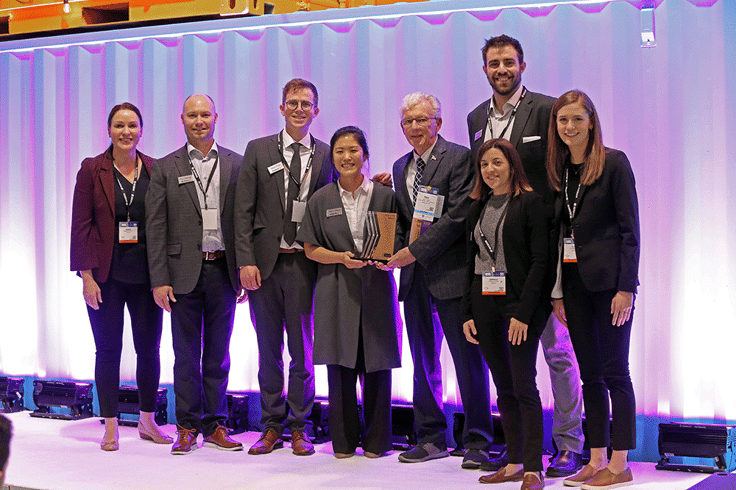 Group of men and women smiling